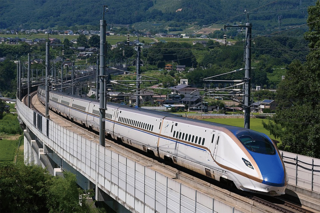 Japanese Shinkansen bullet train speeding through the countryside.