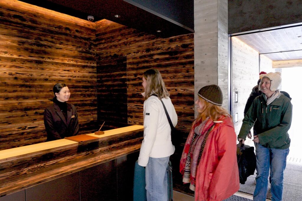 Guests check-in to Cedars Hotel