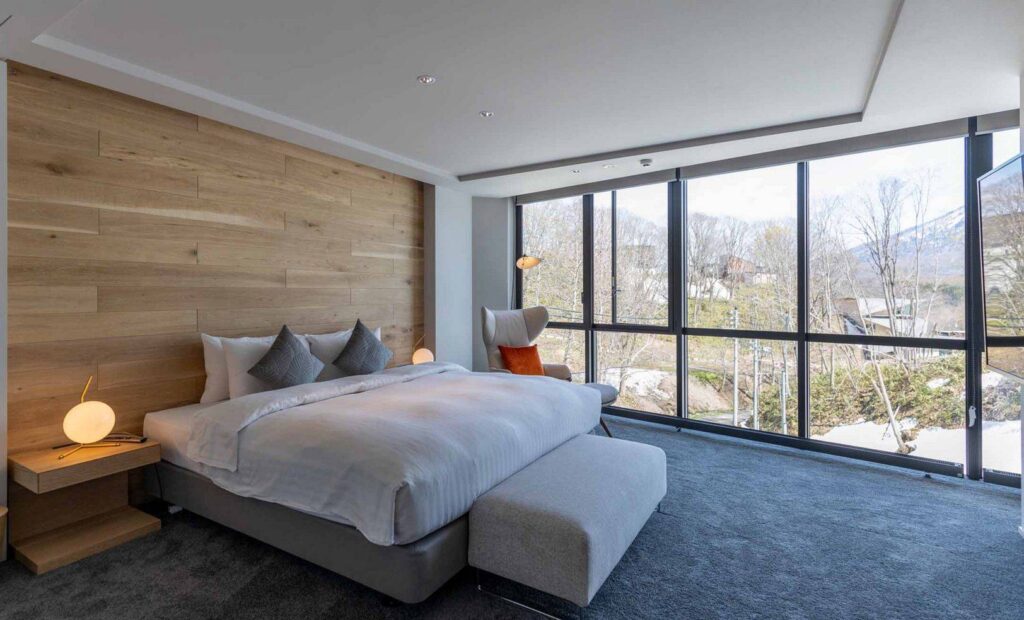 bedroom with floor-to-ceiling windows